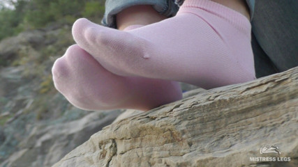 Mistress Legs: Sexy feet in pink ankle socks on the seashore