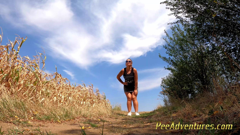 Pee Adventures: Chubby brunette pee on a dirt road in the middle...