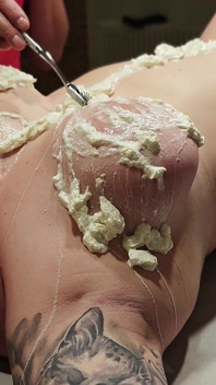 A Naked Woman with Huge Tits in a Massage Parlor Using Whipped Cream.