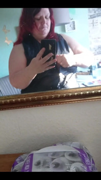 Showing off in a cool lab coat in front of the mirror