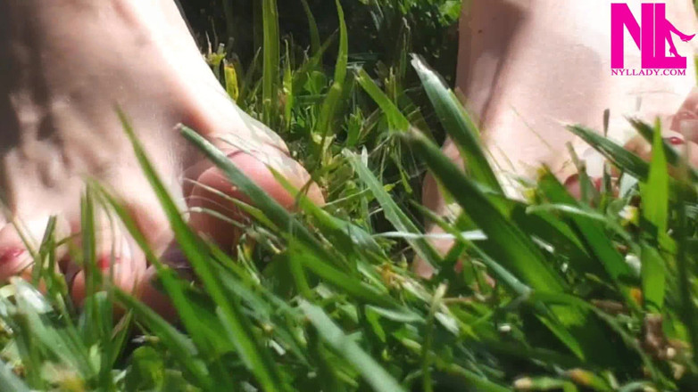 Nyllady: Nyllady Walking Barefoot on Th Grass in a Park