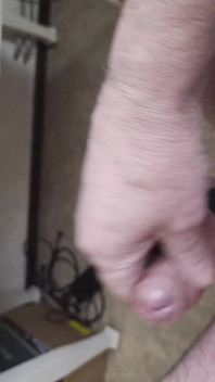 My Friend Sits in a Chair and Jerks His Cock While Watching the Video Until He Orgasms