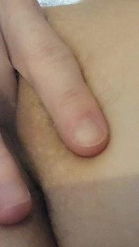 Up Close Playing with Her Holes