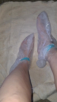 Pedicure Step Feet in Plastic Foot Mask Booties