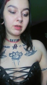 Sexy Alternative Brunette Drinking Sparkling Water and Burping