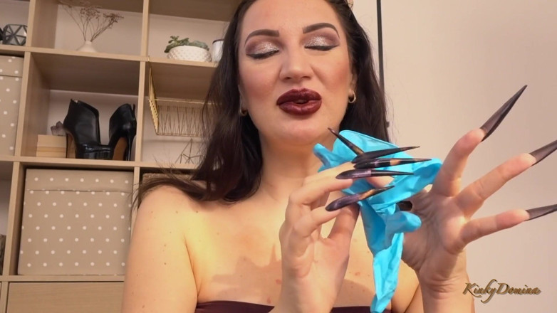 KinkyDomina: Kinkydomina Christine puts on a pair of latex gloves with...