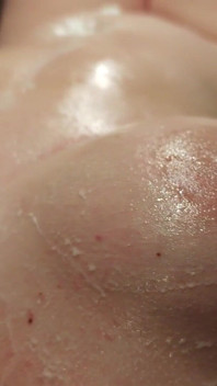 A Naked Woman with Huge Tits in a Massage Parlor Using Whipped Cream.