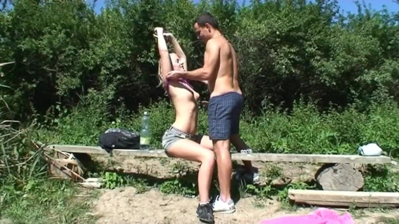 East Public: The blonde smokes a cigarette in the countryside, a guy...