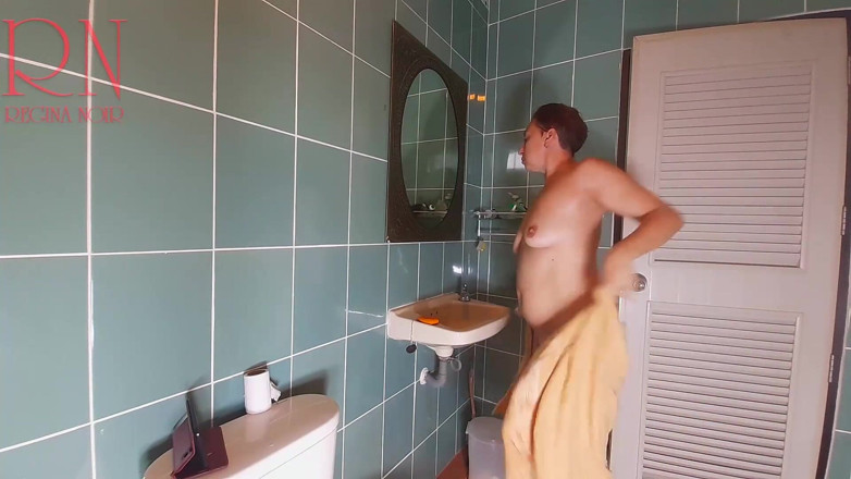 Regina Noir: Nudist housekeeper Regina Noir washes in the shower with soap,...