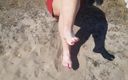 Pov legs: Airing both feet in the hot sand.