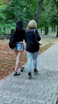 Two Lesbian Mistresses Are Strolling Through the Park