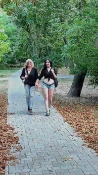 Two Lesbian Mistresses Are Strolling Through the Park