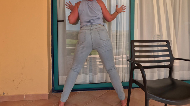 Emma Voyeur: Balcony Full Bladder - Locked and Wetting Jeans
