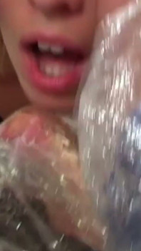 Blonde MILF in Raincoat Sucks Plastic Wrapped Cock