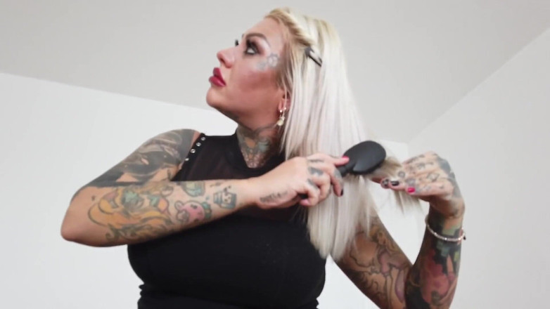 Fetish videos by Alex: Tattooed blonde MILF combing her hair.