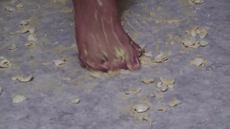 Foot Girls: Brunette crushing food in the kitchen