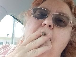 BBW nurse Vicki adventures with friends: BBW smoking in pink sweater in her car talking to...