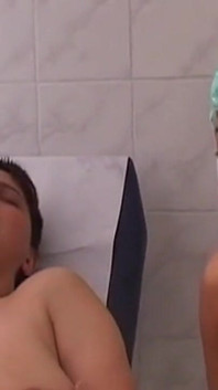 Mature Nurses Intimately Explore Patient on Exam Table