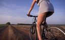 Teasecombo 4K: Cycling Outdoors and Flashing Ass in Miniskirt
