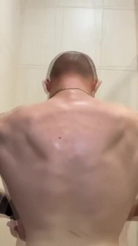 Alpha Shows off His Back Muscles
