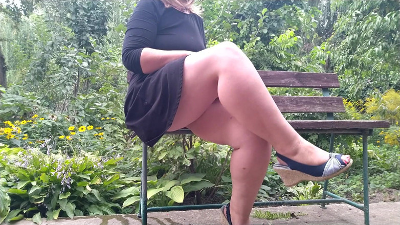 Elena: Lustful MILF pissing while sitting on a bench