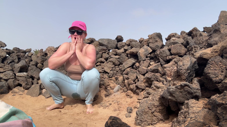 Emma Voyeur: Beach Jeans Wetting - Sandy and Soaked