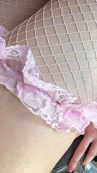 Slim Beauty with Massive Natural Tits in Pink Fishnet Stockings Teases Her Ass From Behind
