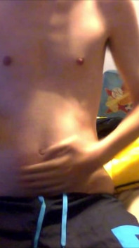 Young Guy Fills His Stomach with Water
