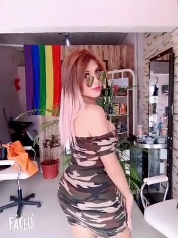 Barbietransxxxx: Tranny in a square showing off her tits in front...
