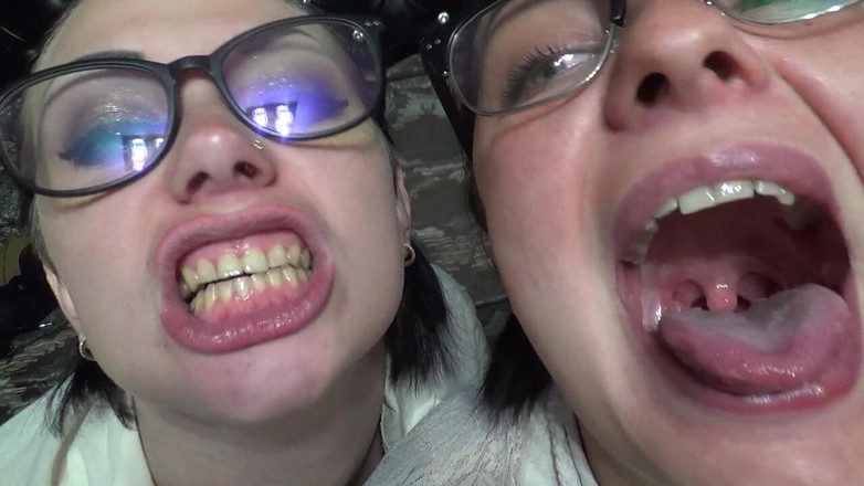 Goddess Misha Goldy: Two business women taunt you with their mouths &amp; tongues before...