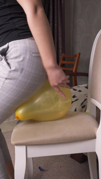 Sexy Girl Pops Balloons in Ripped Pants