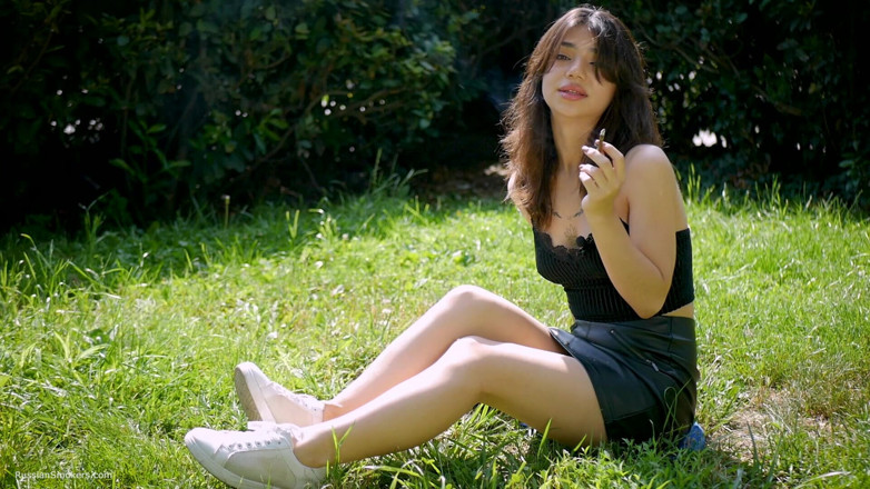 Russian Smokers: Arina Is Smoking One Black Cigarette Outdoors