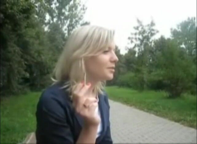 Femdom Austria: Blonde beauty smoking a cigarette outdoors
