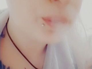 EstrellaSteam: Girl with piercings smokes a cigarette