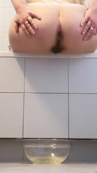 Raven: Peeing in a Glass Bowl While Sitting on the Edge of the Bathtub