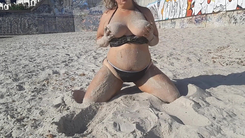 Sunny Loveli: Games in the sand on the beach. Touching big tits...