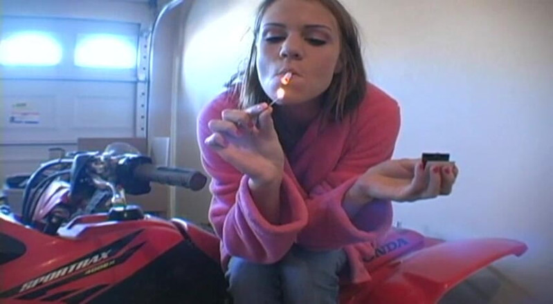 Femdom Austria: Lovely teen in bathrobe smoking a cigarette in garage