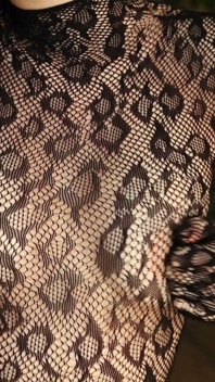 I'm Posing in a Black Fishnet Bodysuit and Heels, Pleasuring Myself with My Fingers.