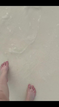 Running my bare feet on the white beach sand by the ocean.