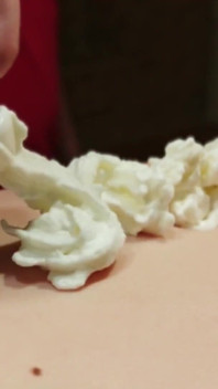 A Naked Woman with Huge Tits in a Massage Parlor Using Whipped Cream.