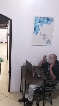 While the Husband Works, the Wife in a Towel Greets the Delivery Man
