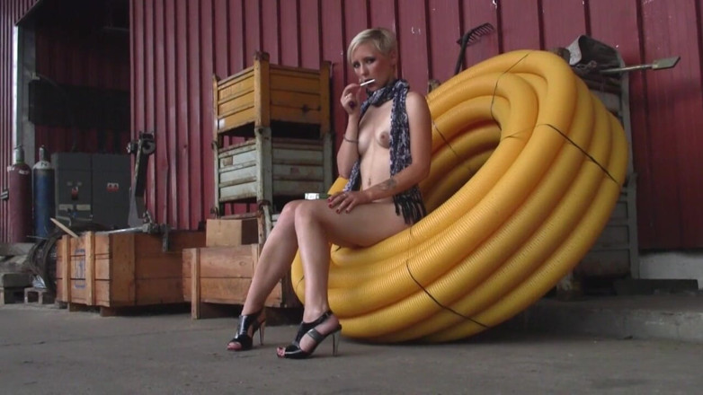 Facial flavor: Blonde girl in heels sits naked in the factory and...