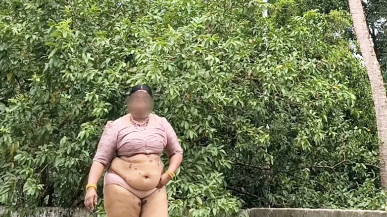 Anne Ipe: A Full-figured Woman in a White Skirt and Pink Top...