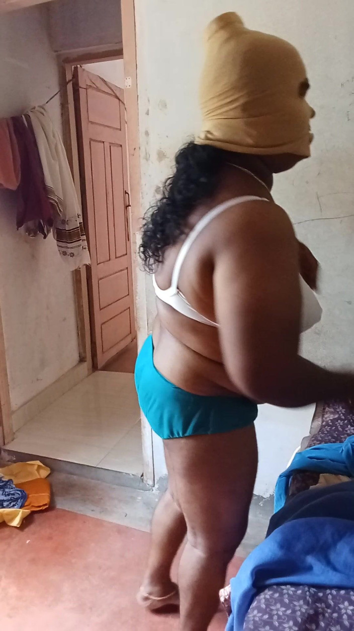 Bedroom: Lady in bedroom dress change performance videos