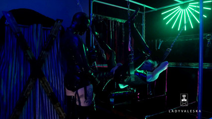 Lady Valeska: The rubber Domme the giant dildo and the gimp