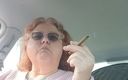 BBW nurse Vicki adventures with friends: BBW smoking in pink sweater in her car talking to...