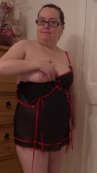 Striptease in Blank Pink Bodice Playing with Breasts