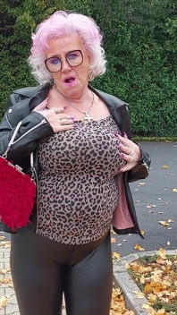 Naughty Granny Tongue Out Flashing Big Tits in Public