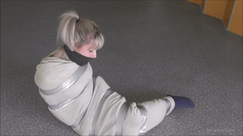 Restricting Ropes: Tied up by her captor on the floor