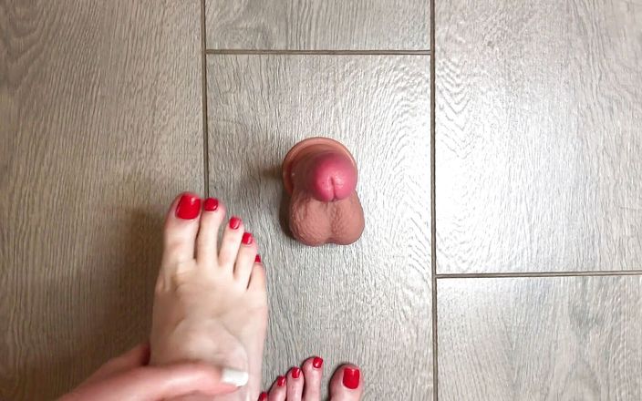 Homemade handjob: Sexy red nailed feet play with a dildo